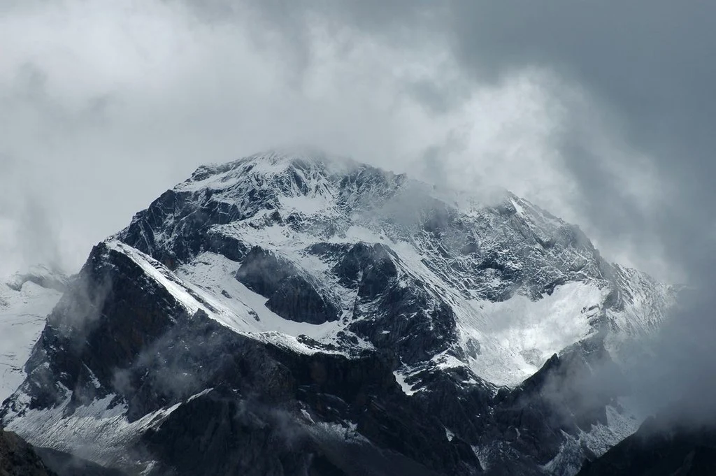 Om Parvat mountain in Pithoragarh, Uttarakhand, featuring the naturally formed 'Om' symbol on its snow-covered slope.
